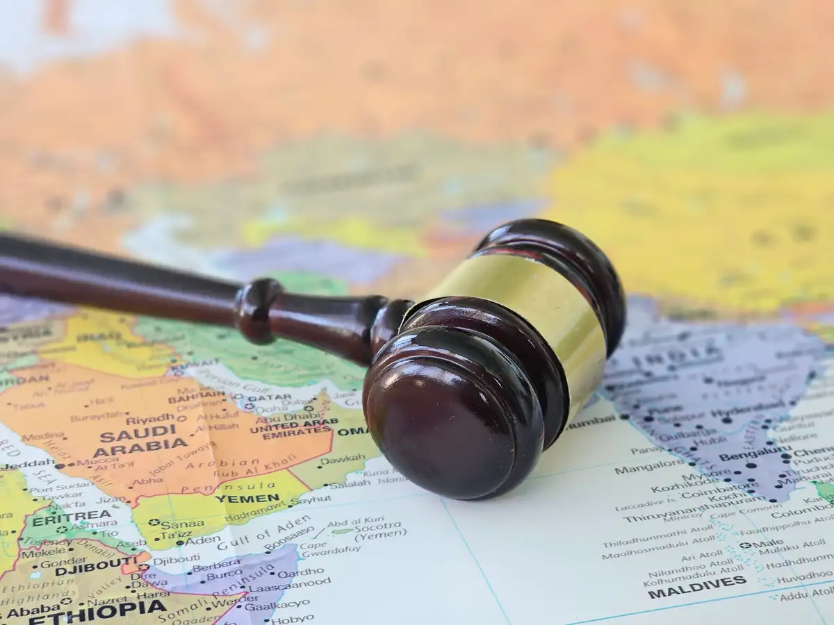 A gavel resting on a map of the Middle East